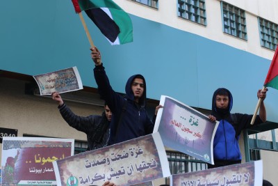 Students protest in Gaza Strip to repair and rebuild schools at UNRWA building. Photo Copyright (C) 2014 Mohammed Asad. All Rights Reserved. Permission to republish given with full credit to Mohammed Asad and The Arab Daily News.