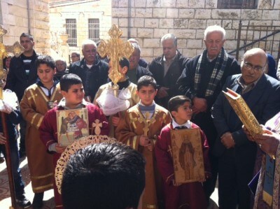 Children carry Icons of the Orthodox Church at services in Taybeh, Palestine March 1, 2015