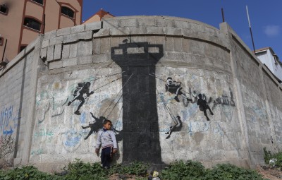 Murals painted by British artist Banksy. Copyright 2015 Mohammed Asad All Rights Reserved. Permission to reprint with full attribution to Mohammed Asad and The Arab Daily News