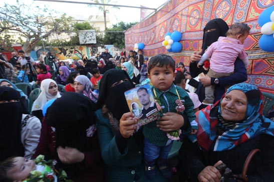 Palestinians celebrate babies born of fathers being held in Israel's gulag detention centers during protests of abuses by Israeli guards. (C) 2015 by Mohammed Asad. All Rights Reserved. Permission granted to republish with credit to Mohammed Asad and The Arab Daily News.