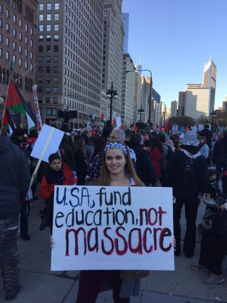 Many signs held at the protest denounced Israeli atrocities and also urged the United States to stop funding Israeli's atrocities and war crimes. Israel receives more than $5 billion a year from American taxpayers. Photo courtesy of Dr. Atiyeh Salem