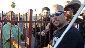 Jon Ritzheimer, right, talks to a member of the board, Muhammad Alrokh, left, outside the Islamic Community Center of Phoenix, Friday, May 29, 2015. About 500 protesters gathered outside the Phoenix mosque on Friday as police kept two groups sparring about Islam far apart from each other. (AP Photo/Rick Scuteri)