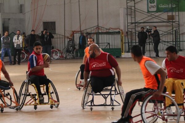 Disabled Palestinians compete in Basketball tournament. Copyright (C) 2015 Mohammed Asad. All Rights reserved. Photos may be reproduced with proper credit to Mohammed Asad and the Arab Daily News