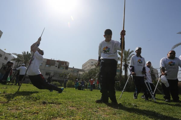 Palestinians support Gaza's wounded olympians during a paralympic commemoration in the Gaza Strip. Copyright (C) 2016 Mohammed Asad. All Rights reserved. Photos may be reproduced with proper credit to Mohammed Asad and the Arab Daily News