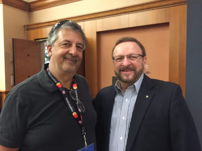 The author Ray Hanania (left) with Wayne Messmer, the popular sports figure who sings the National Anthem (right). Photo courtesy Ray Hanania. Permission granted to republish with full attribution