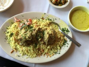 Mansaf (mensiff) -- lamb, rice, toasted Syrian pita bread and jameed sauce -- popular as a holiday dish and the national dish of Jordan. Photo courtesy of Ray Hanania