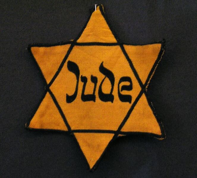 Yellow badge Star of David called "Judens...