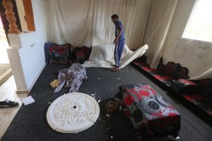 A Palestinian inspects damage to his home caused by Israeli air and missile fire Monday June 26, 2017. Photo courtesy of Mohammed Asad. All Rights Reserved