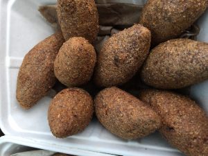 Fried Kubbah, Kibbeh made from burghul stuffed with lamb and browned sliced almonds or browned pine nuts. Photo courtesy of Ray Hanania