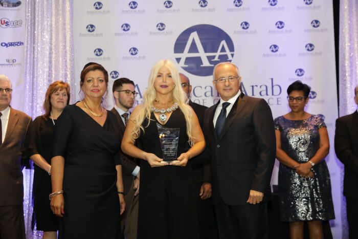 Michigan Accident Attorney Joumana Kayrouz receives the "The Economic Bridge Builder of the Year" award at the 25th Annual Arab American Chamber of Commerce “Building Economic Bridges” gala Oct. 13, 2017 for her contributions to the business and legal community. Michigan Accident Attorney Joumana Kayrouz (center) is joined by Chamber Exec. Director Fay Beydoun and Board Chairman Ahmad Chebbani. (Photo courtesy of Joumana Kayrouz www.YourRights.com.)