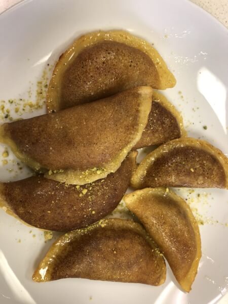 Qataif, Kataif, Atayef, Qatayef, Arabian Middle Eastern pancake treat with almonds, walnuts, pistachios and even cheese, covered in syrup