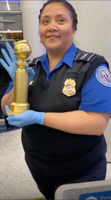 TSA Agent at Los Angeles Airport Security Jan. 7, 2020 poses with Ramy Youssef's Golden Globe Award after it was x-rayed and then wiped down as is required procedure. Photo courtesy of Ramy Youssef's Instagram