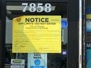 Closure notice posted on the doors and windows of Arab American businesses during Mayor Lori Lightfoot's closure of Arab owned stores in June - Sept. 2021. Photo courtesy of Ray Hanania
