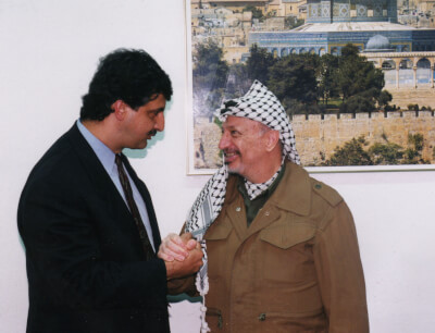 Ray Hanania meeting Yasir Arafat when Hanania served as President of the Palestinian American Congress, 1995, in the Gaza Strip.