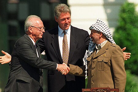 President Clinton presides over White House ceremonies marking the signing of the peace accord between Israel and the Palestinians, with Israeli Prime Minister Yitzhak Rabin, left, and Palestinian leader Yasser Arafat, right, in Washington Sept. 13, 1993. (Courtesy Wikipedia)