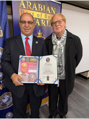 American Arab Chamber President Hassan Nijem presented Fayez Khosindar with the "Best of the Best" award for 2025 for defendign the rights od Limo and Uber Black Drivers