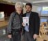 Maria Pappas poses with Salman Aftab with her new memoir "Maria the Pappas" at the Sabeel Center in Des Plaines, Illinois on Oct. 11, 2026