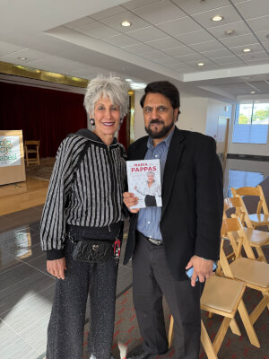 Maria Pappas poses with Salman Aftab with her new memoir "Maria the Pappas" at the Sabeel Center in Des Plaines, Illinois on Oct. 11, 2026
